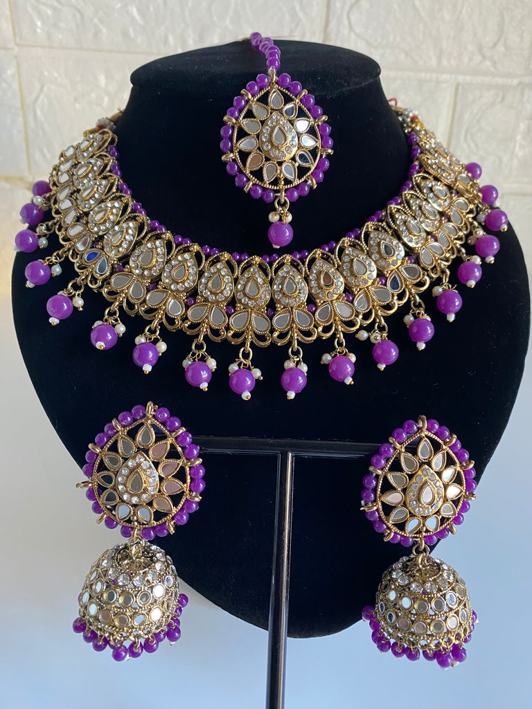 Purple necklace tikka and earrings 