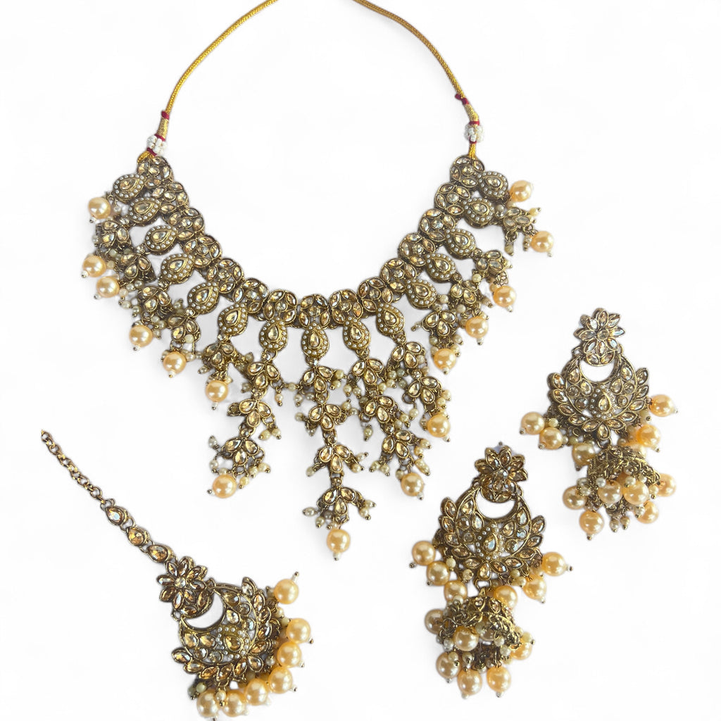 Traditional gold necklace tikka earrings set