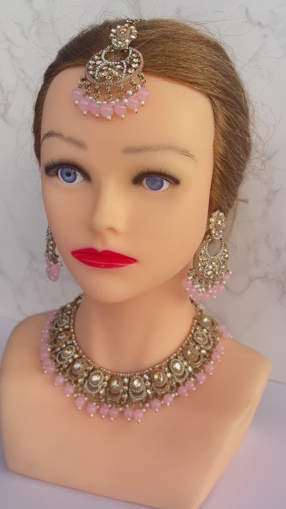 Gold and pink necklace tikka earrings set